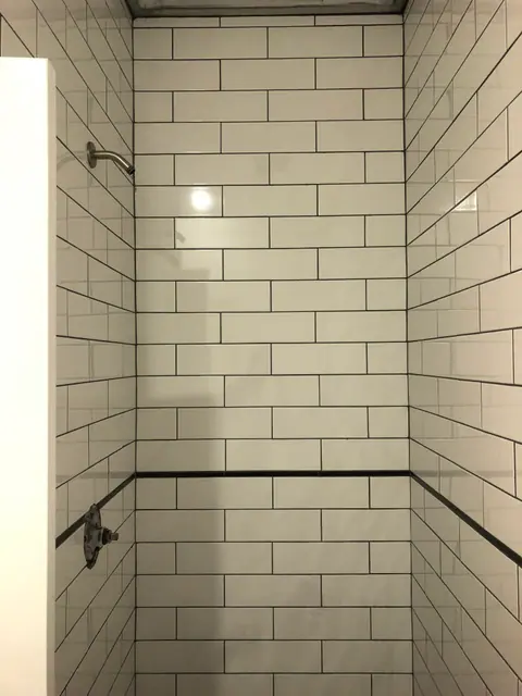 Bathroom renovation with custom tilework and clean fixtures