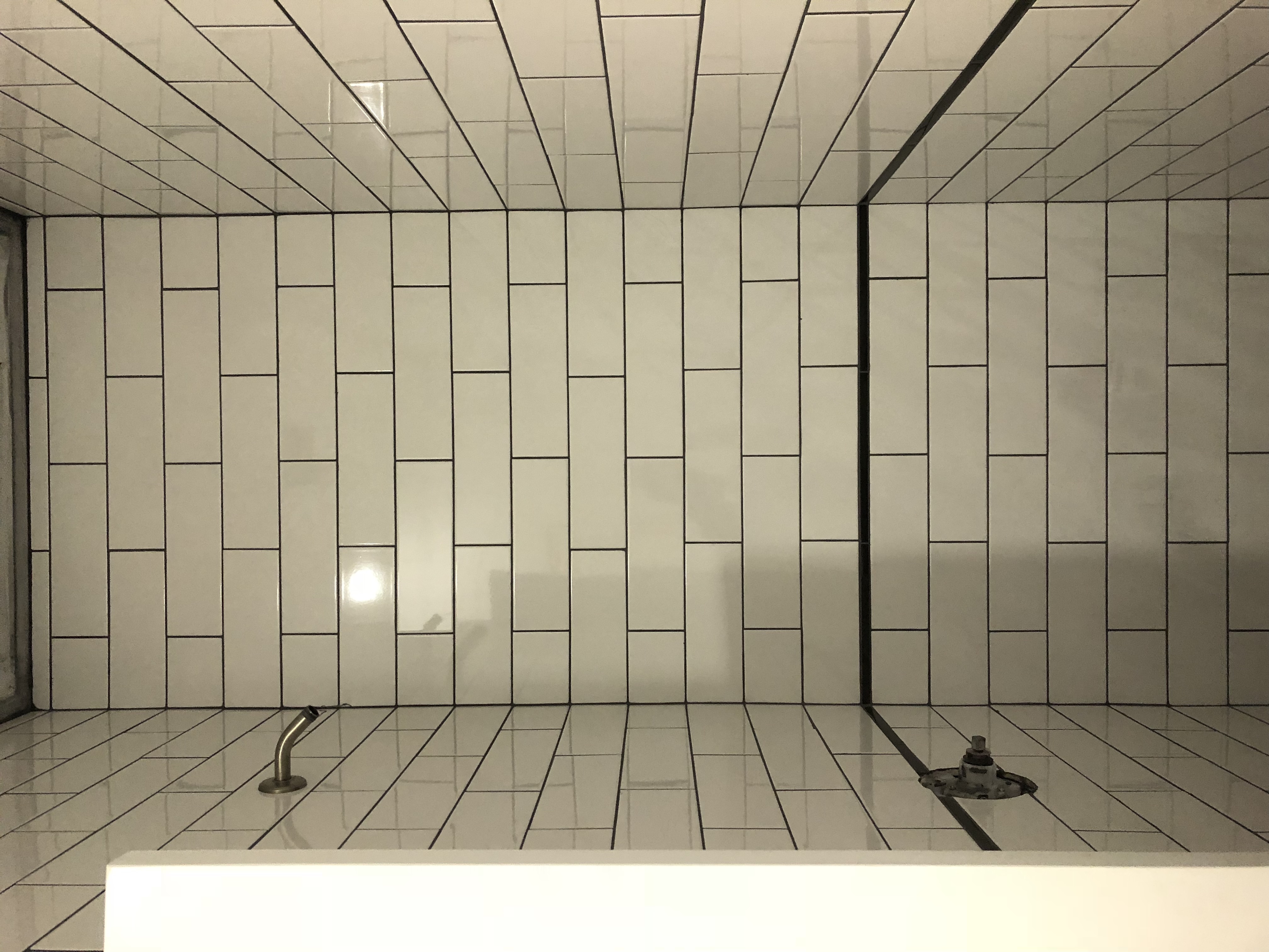 Bathroom renovation with custom tilework and clean fixtures