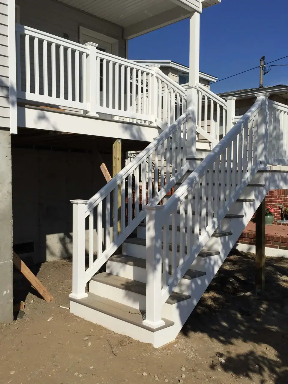 Deck construction with stairs and railing installation