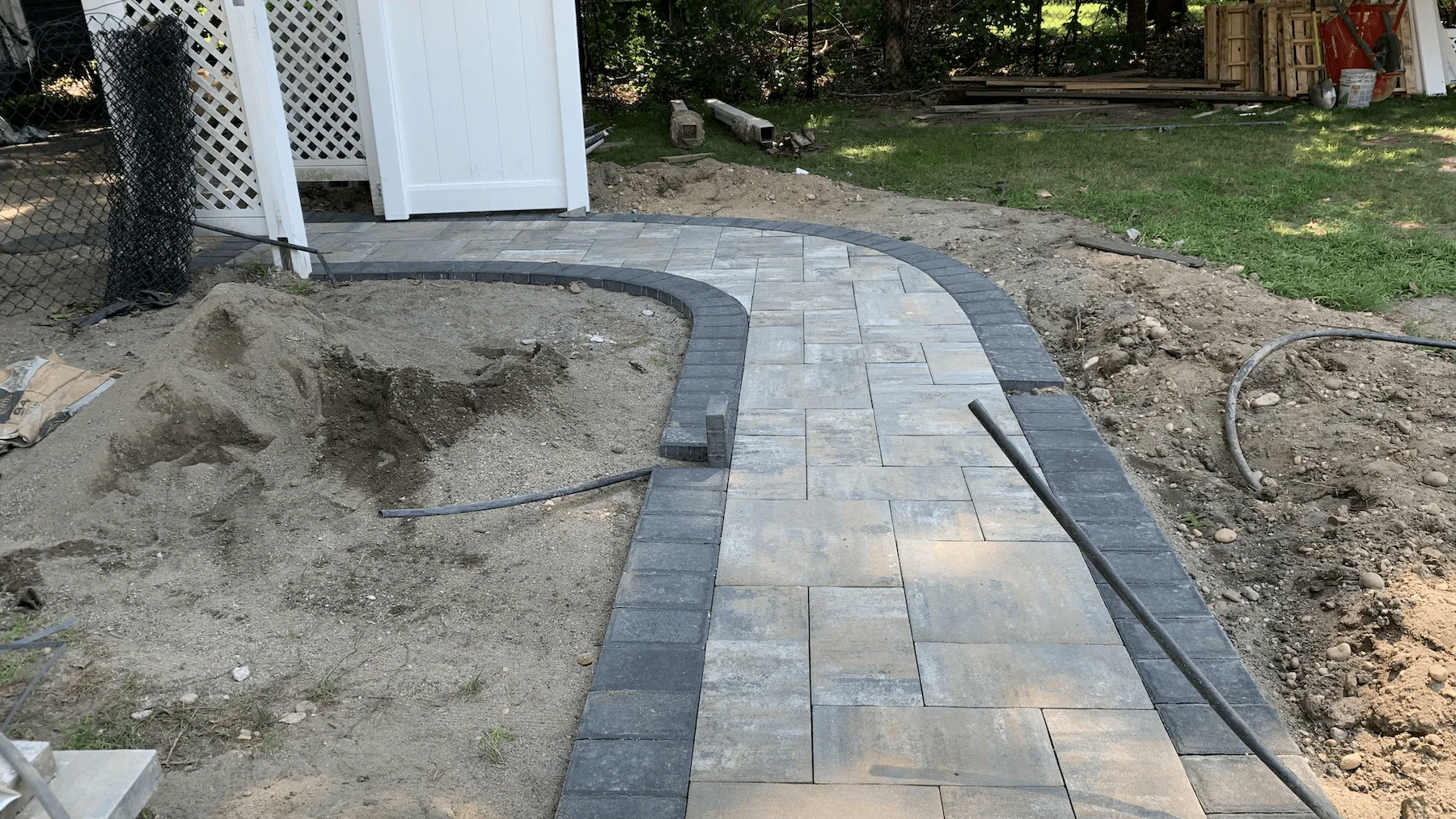 Patio and paver installation with poolside hardscape